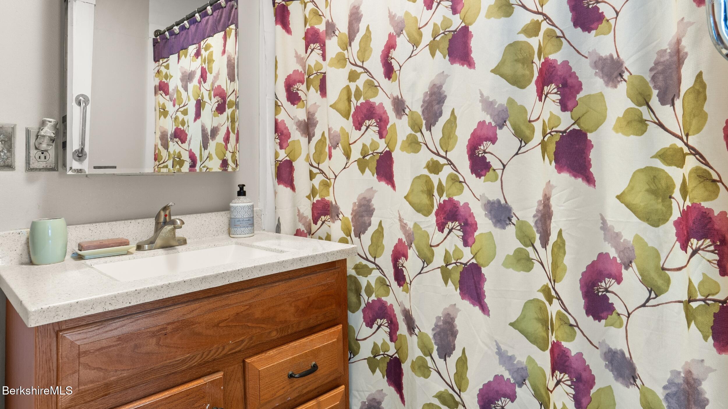 93 South Main Road Otis, MA 01253 - Photo 23 of 27 a bathroom with a sink and a mirror
