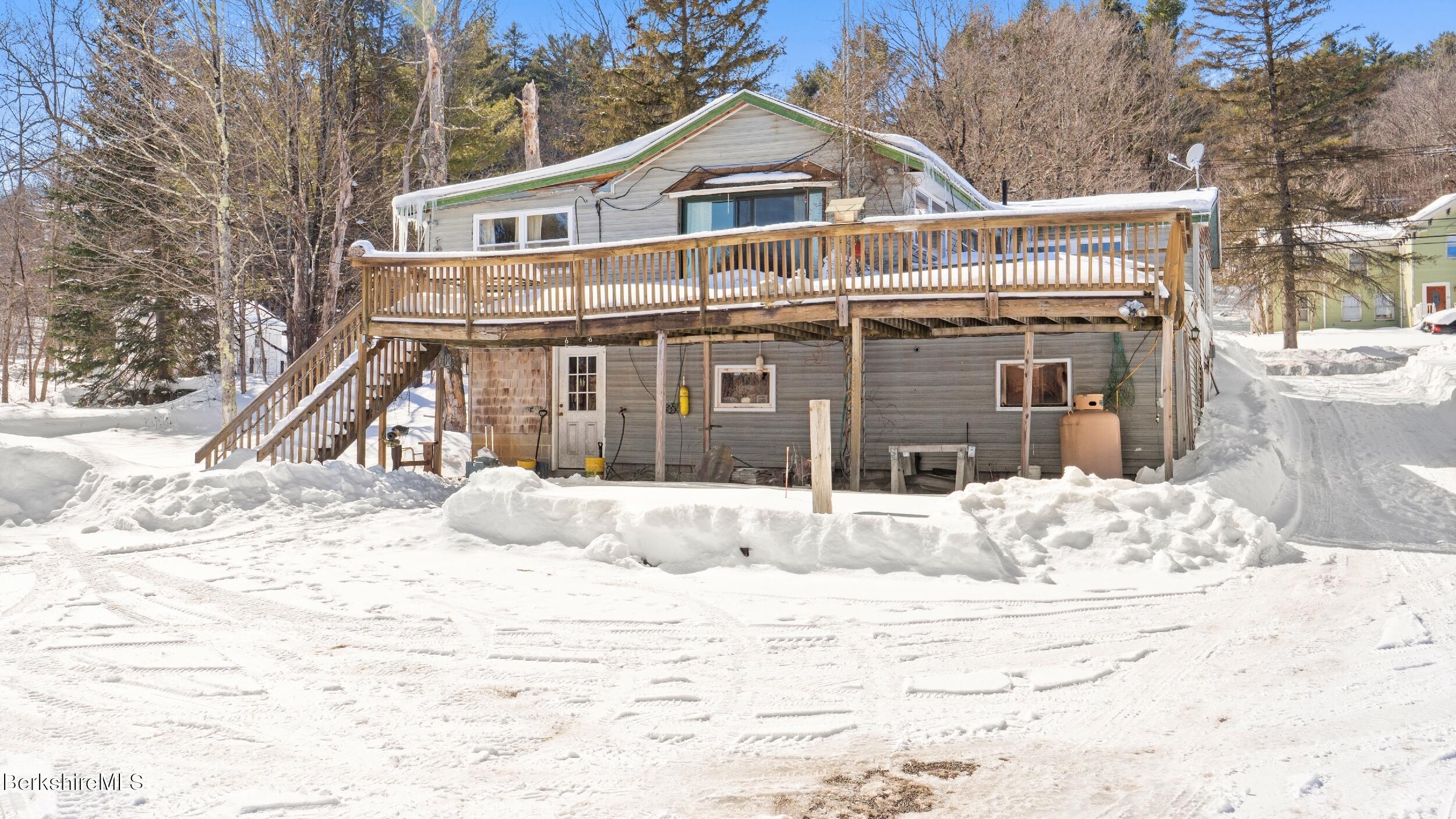 93 South Main Road Otis, MA 01253 - Photo 25 of 27 a front view of a house with a yard