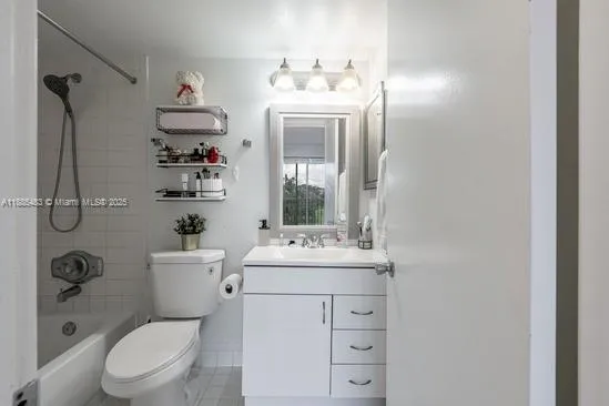 a bathroom with a sink a toilet and shower curtain