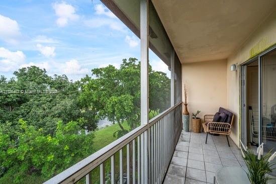 13255 Southwest 7th Court, Unit 403D Pembroke Pines, FL 33027 - Photo 16 of 19 a view of balcony with furniture
