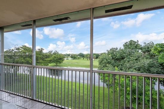 13255 Southwest 7th Court, Unit 403D Pembroke Pines, FL 33027 - Photo 17 of 19 a view of a city from a balcony