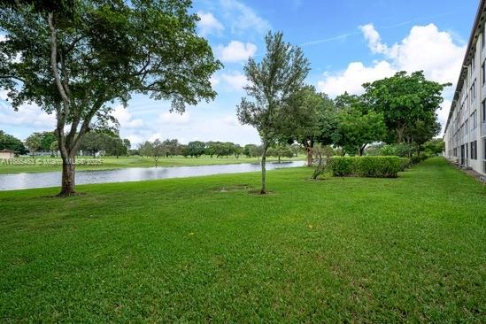 13255 Southwest 7th Court, Unit 403D Pembroke Pines, FL 33027 - Photo 19 of 19 a view of a park with trees in the background