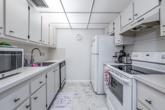 13255 Southwest 7th Court, Unit 403D Pembroke Pines, FL 33027 - Photo 9 of 19 a kitchen with cabinets and steel stainless steel appliances