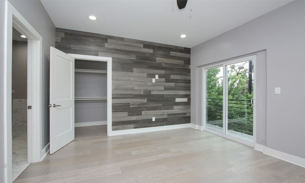 309 East 43rd Street, Unit A Houston, TX 77022 - Photo 19 of 35 a view of an empty room with a fireplace and a large window