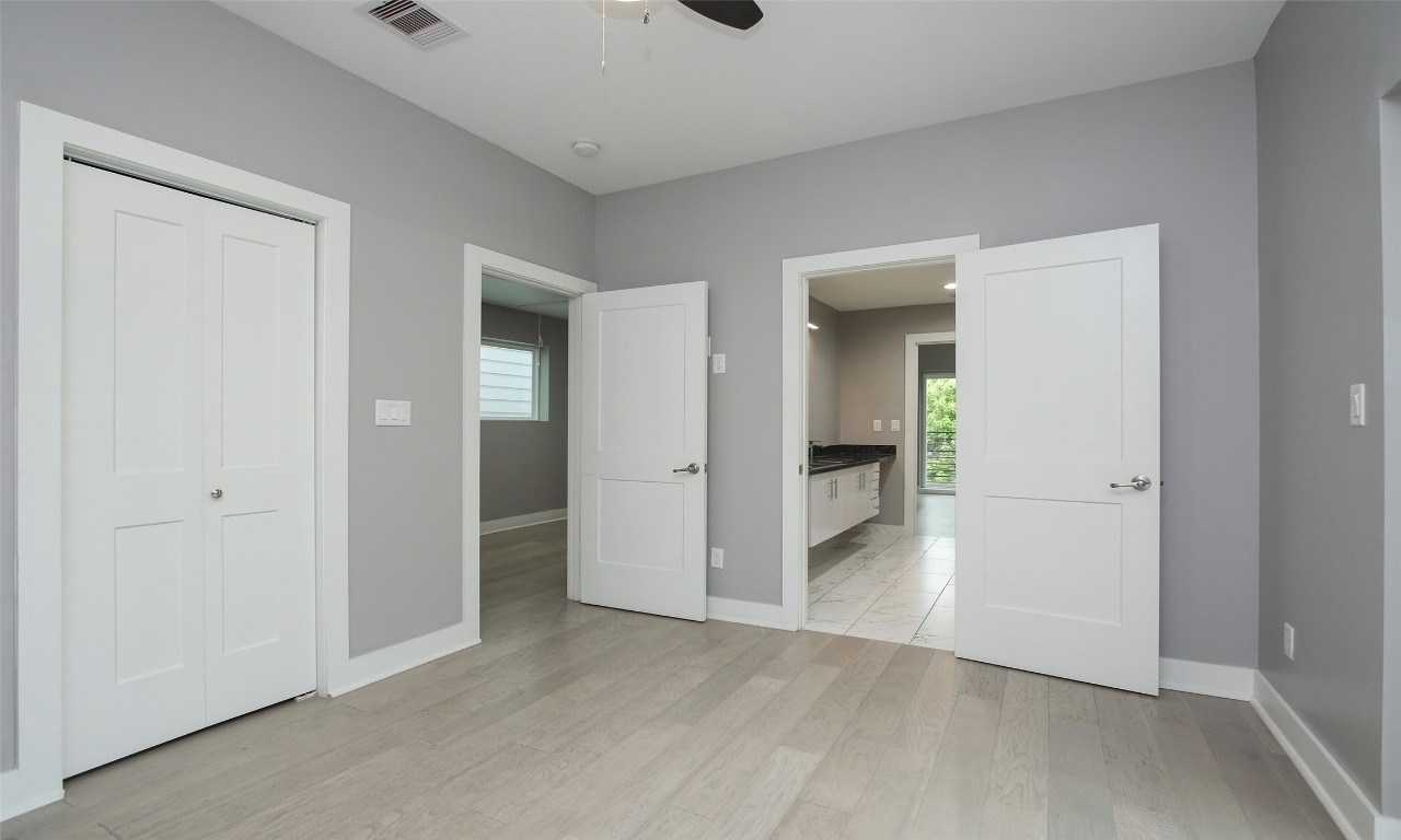 309 East 43rd Street, Unit A Houston, TX 77022 - Photo 29 of 35 wooden floor in a kitchen and an empty room