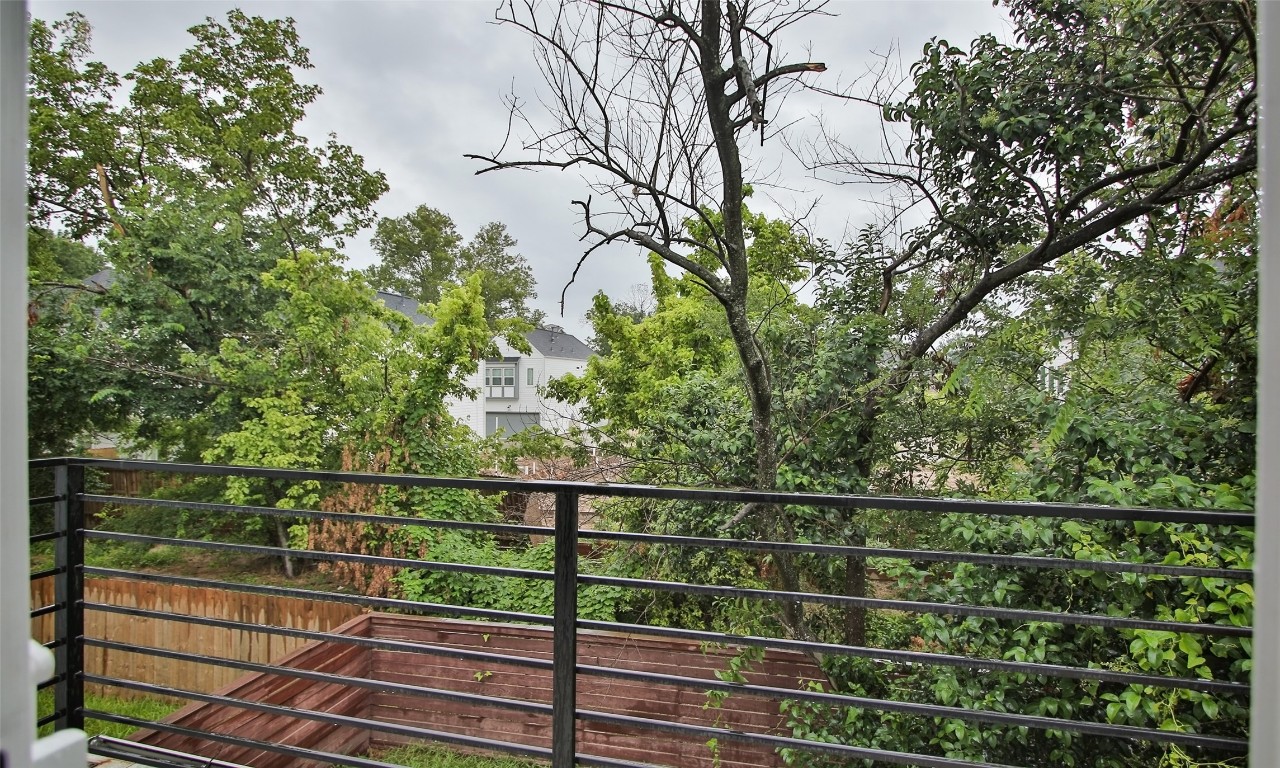 309 East 43rd Street, Unit A Houston, TX 77022 - Photo 31 of 35 a view of a fence and trees