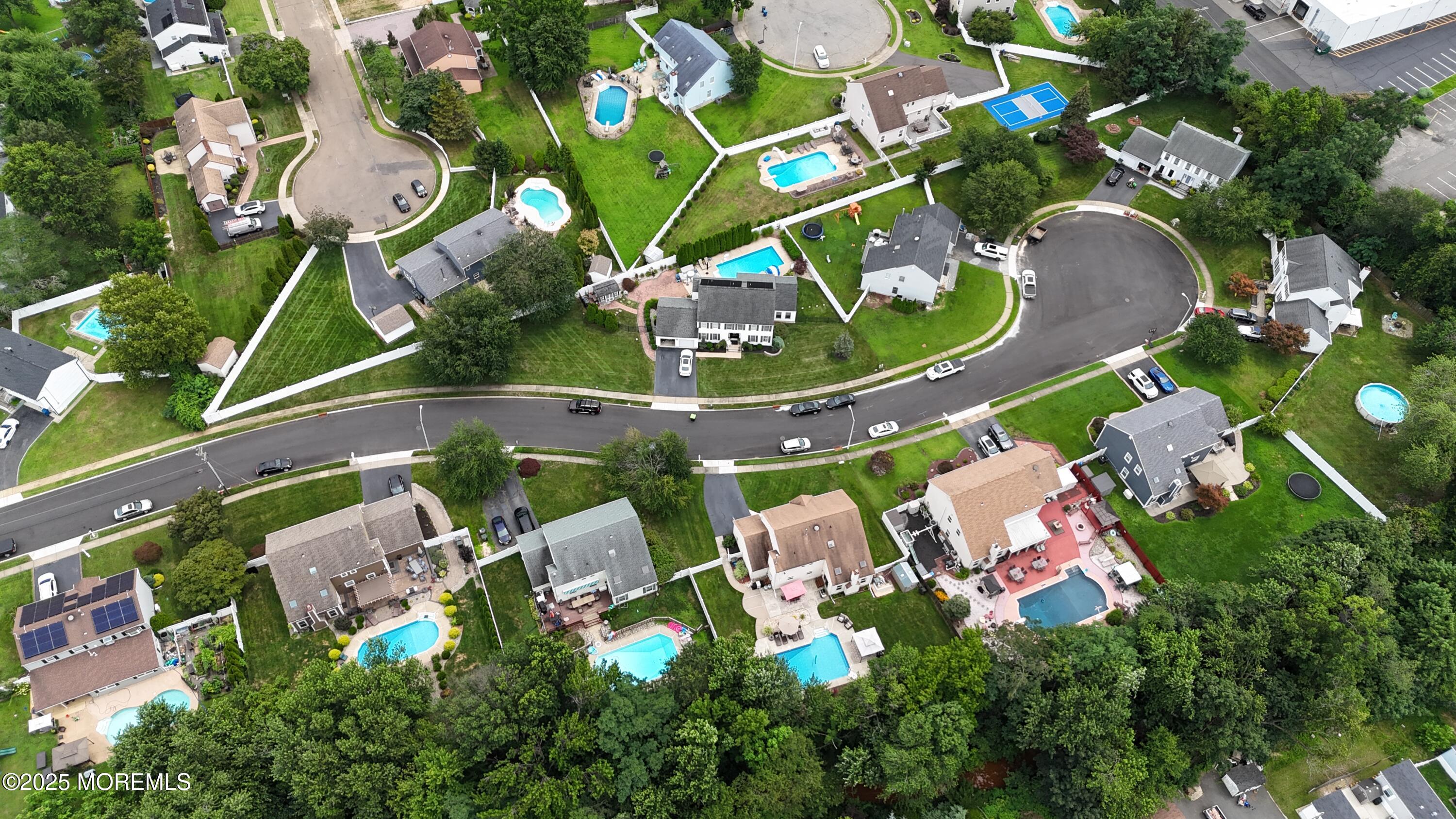 30 Daniel Drive Hazlet, NJ 07730 - Photo 4 of 4 an aerial view of a swimming pool patio chairs and fire pit