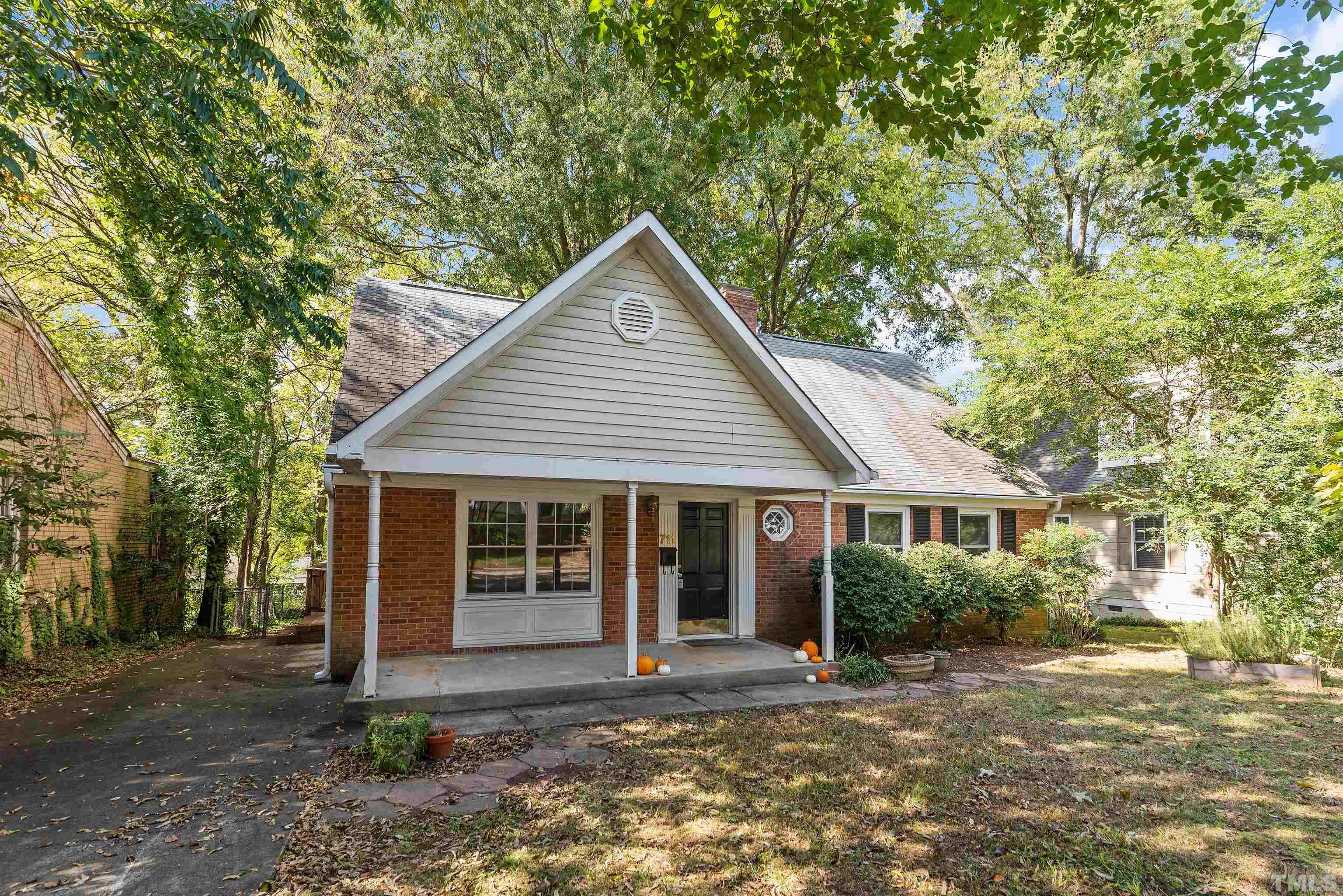 711 Latta Street Raleigh, NC 27607 - Photo 1 of 30 a front view of a house with garden