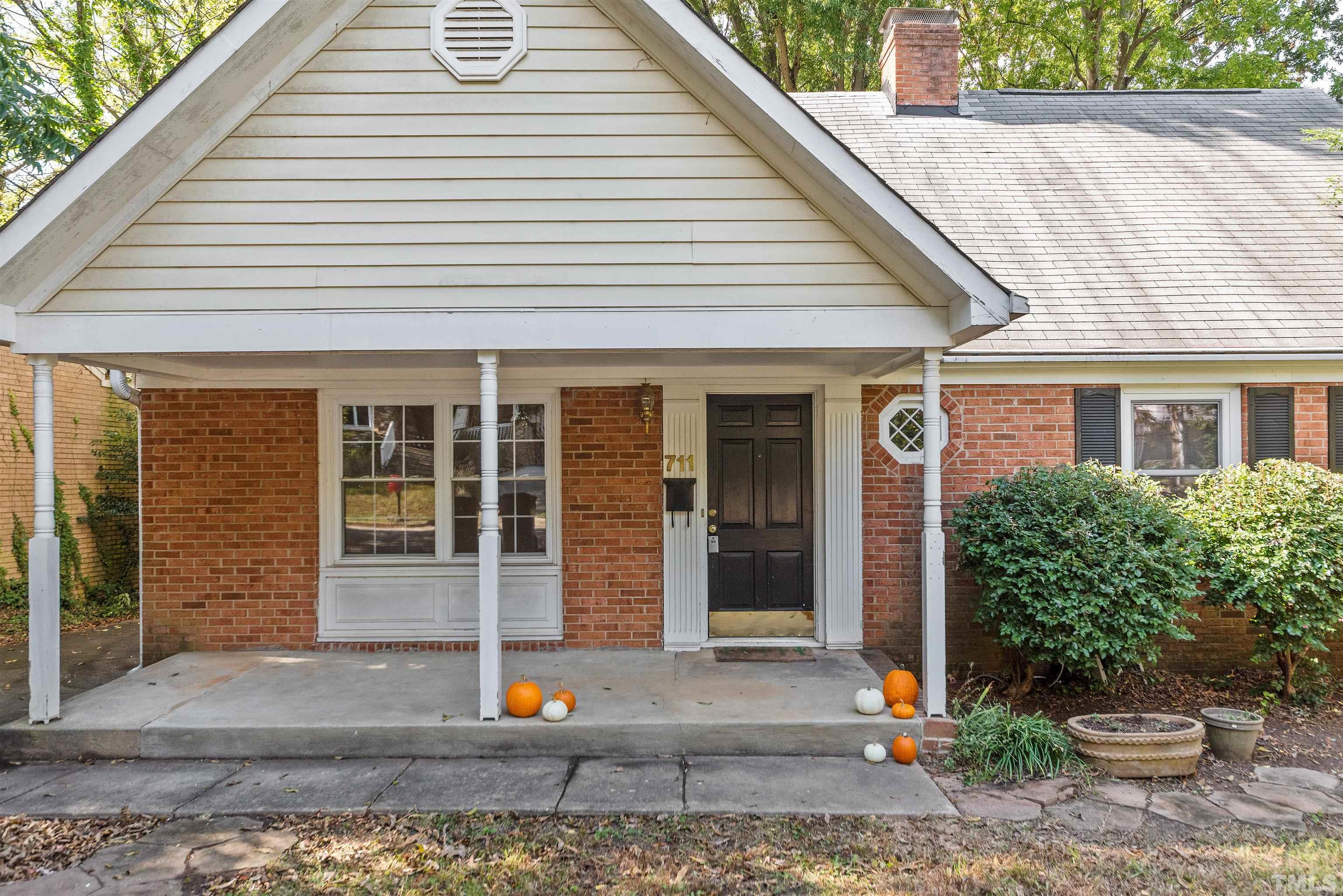 711 Latta Street Raleigh, NC 27607 - Photo 2 of 30 a front view of a house with a yard