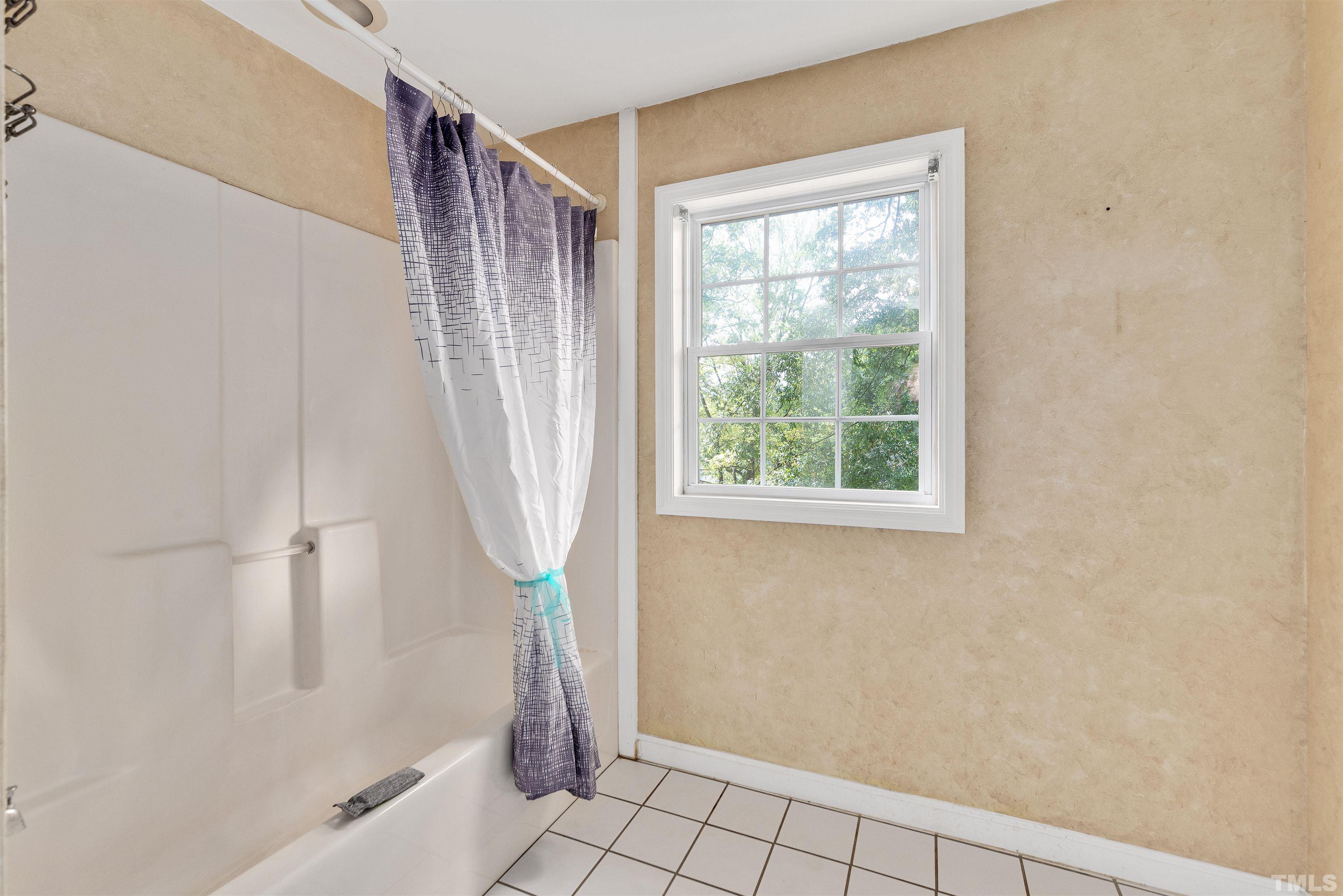 711 Latta Street Raleigh, NC 27607 - Photo 21 of 30 a bath room with a shower