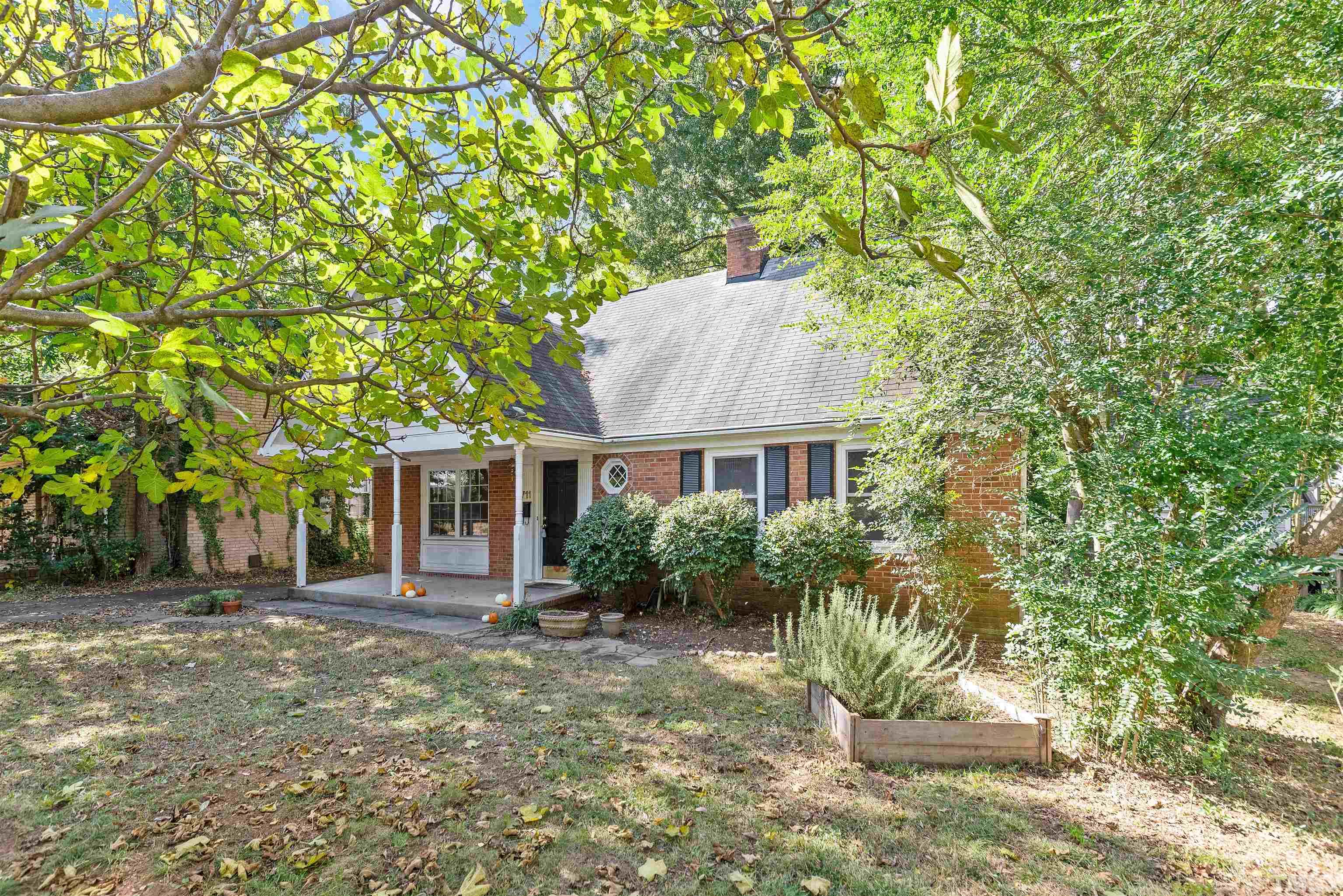 711 Latta Street Raleigh, NC 27607 - Photo 4 of 30 a front view of a house with a yard