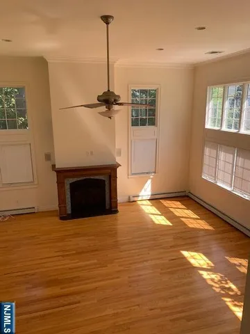 a view of empty room with a fireplace