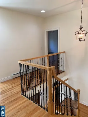 a view of entryway with wooden floor