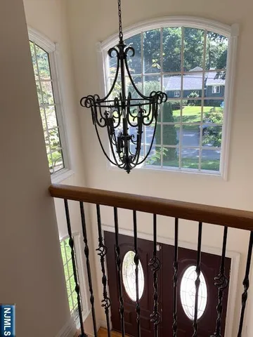 a view of a porch with a table and chairs