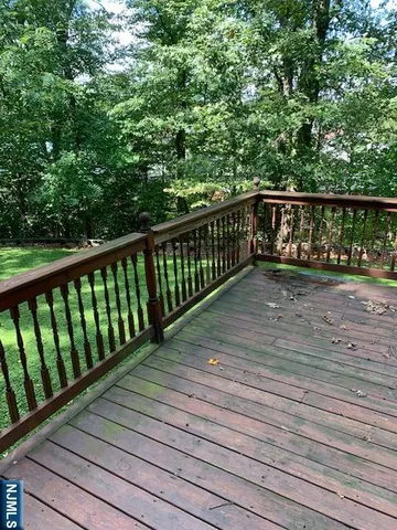 a view of deck with wooden floor and fence