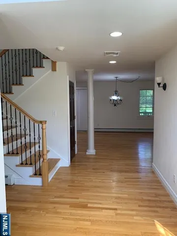 a view of a livingroom with wooden floor