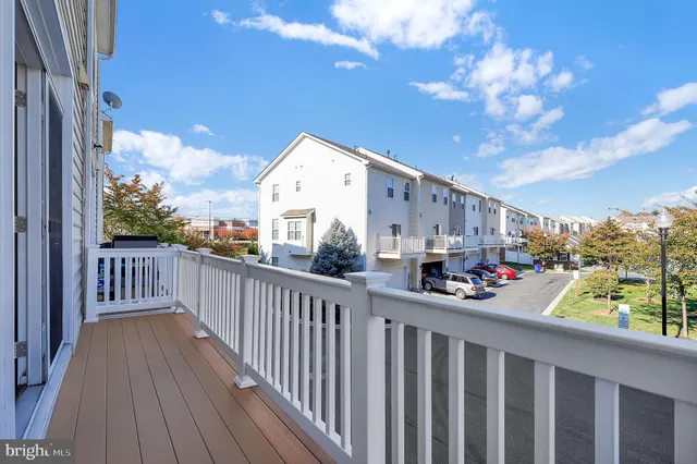 a view of a balcony with wooden floor