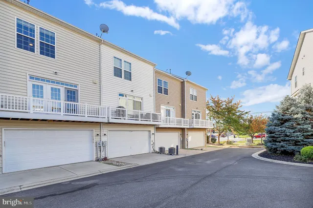 a large white building with a city view