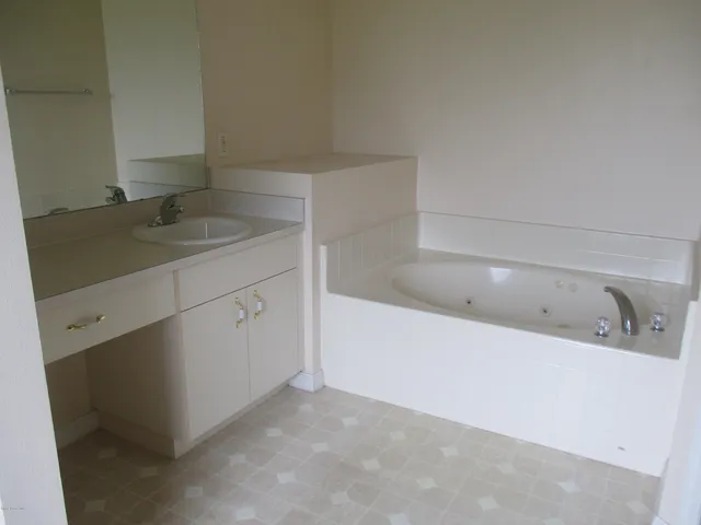 a bathroom with a sink and a bathtub
