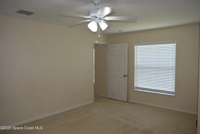 en view of an empty room with a window