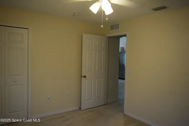 an empty room with a bathroom