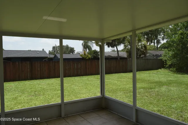 a view of backyard with green space