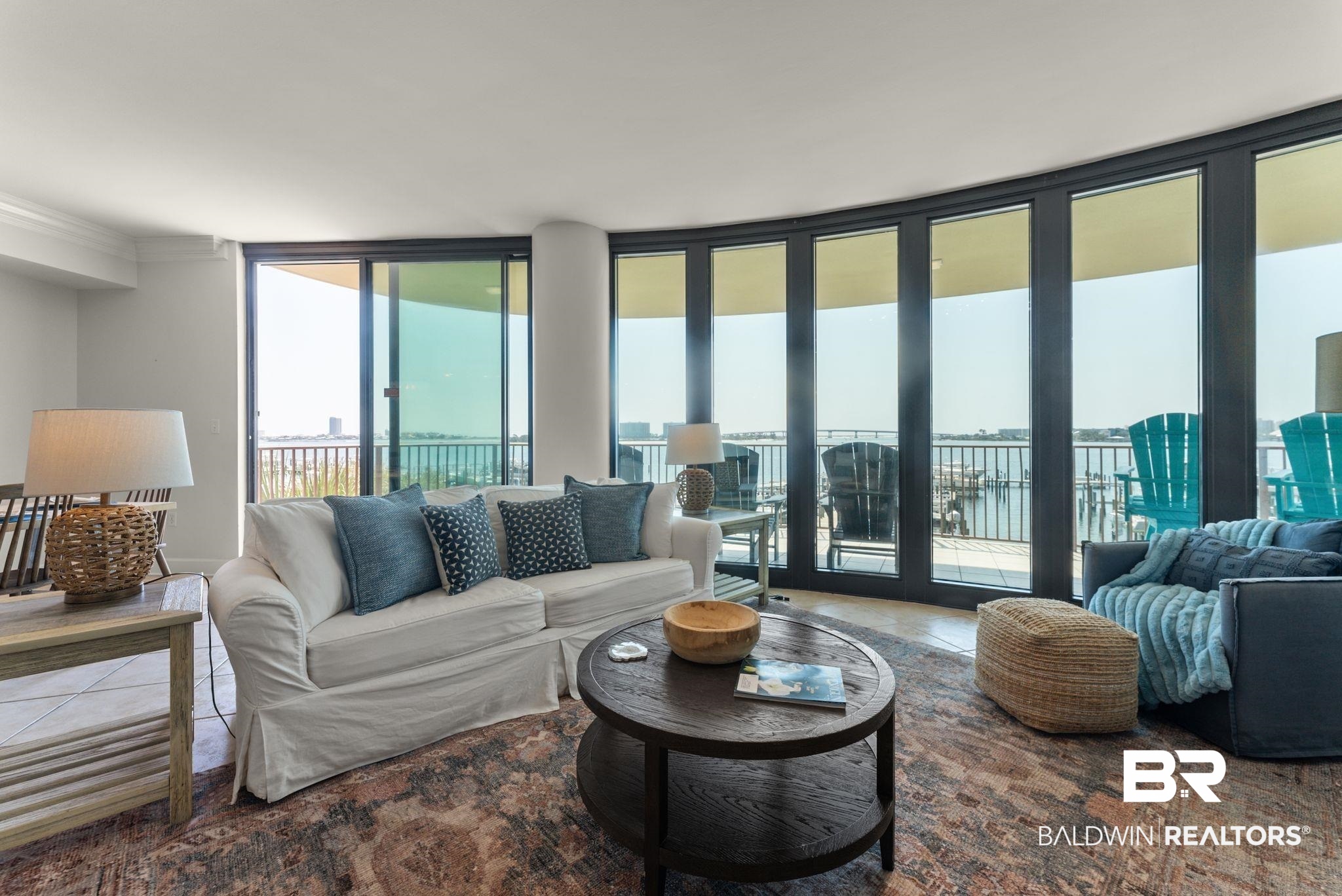 27580 Canal Road, Unit 1233 Orange Beach, AL 36561 - Photo 46 of 79 Tiled living area with crown molding and expansive windows
