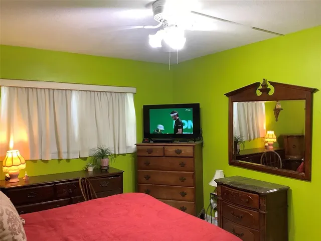 a room with a bed and furniture