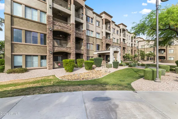 a view of a building with a yard