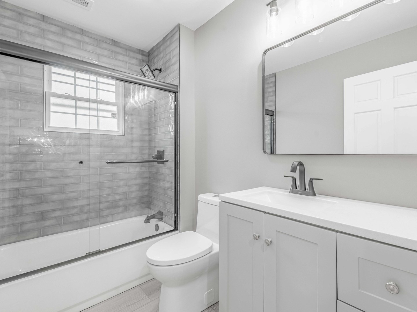 3548 Clinton Avenue Berwyn, IL 60402 - Photo 29 of 49 a bathroom with a sink a toilet and shower