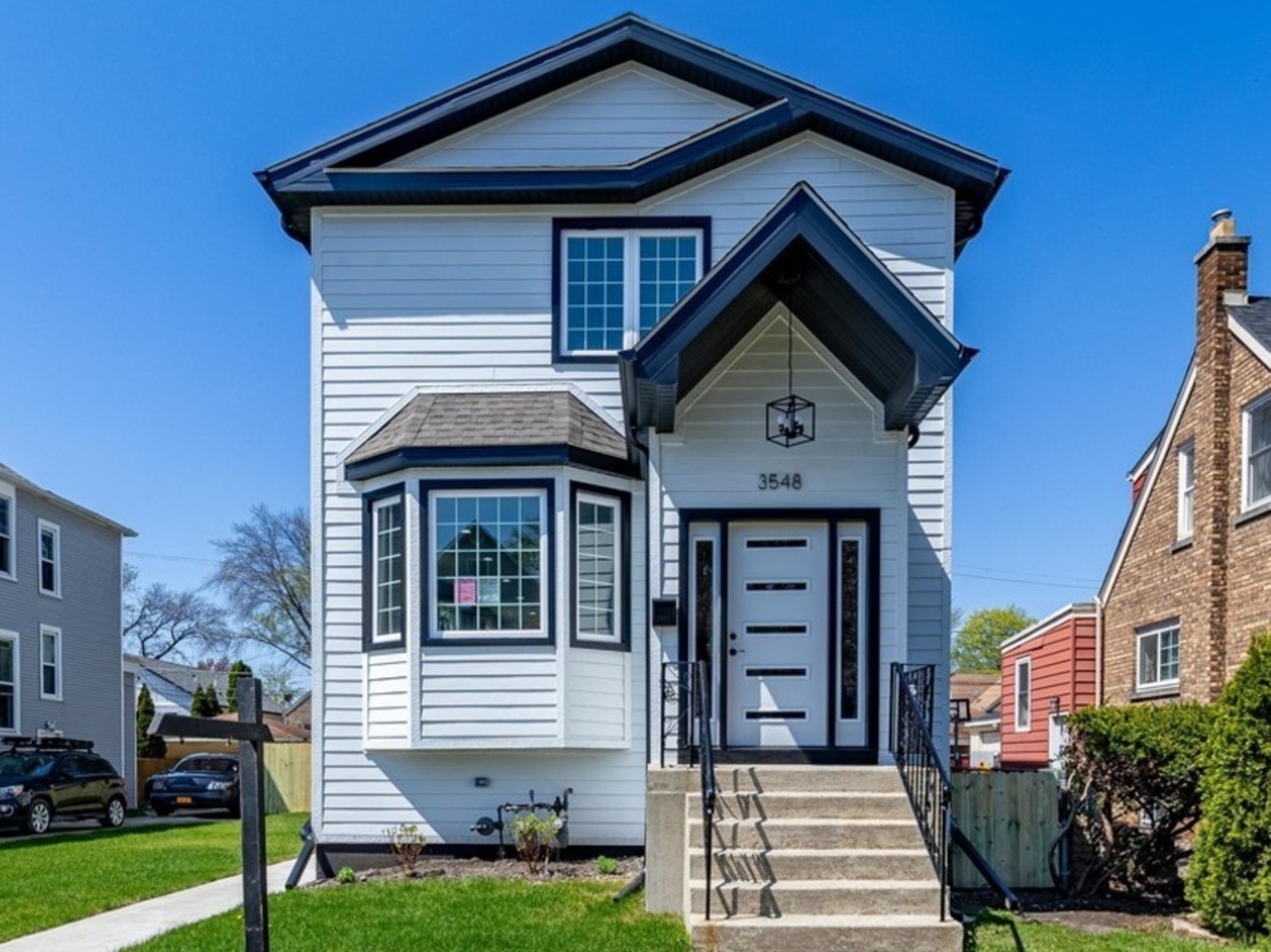 3548 Clinton Avenue Berwyn, IL 60402 - Photo 49 of 49 a front view of a house with garden