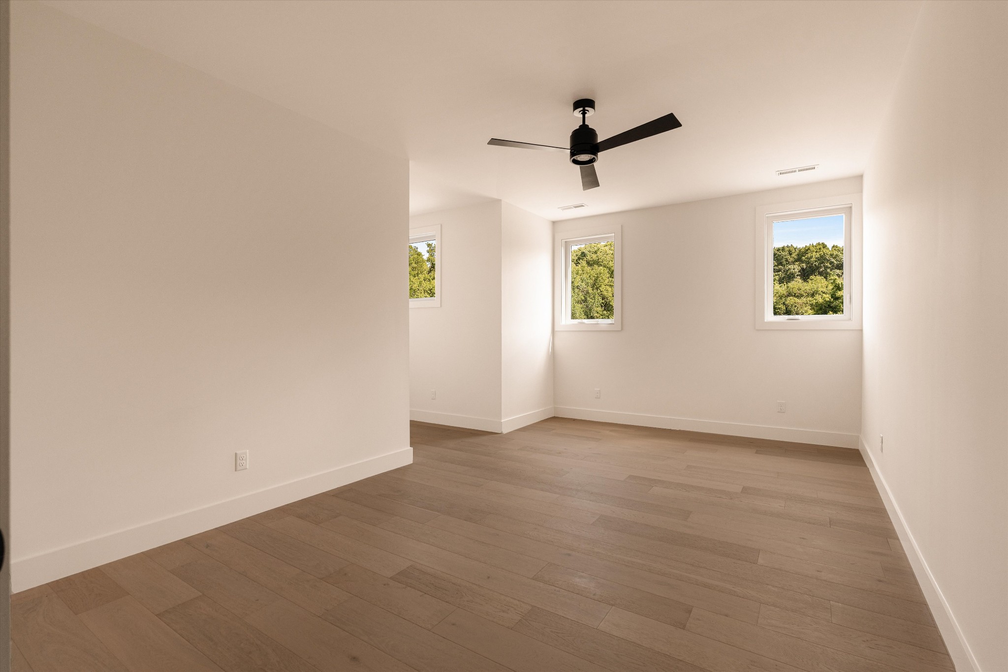 6801 Flat Creek Road College Grove, TN 37046 - Photo 50 of 66 an empty room with windows and ceiling fan