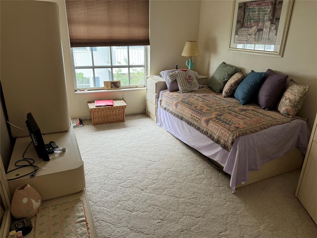 2171 Northeast 66th Street, Unit 830 Fort Lauderdale, FL 33308 - Photo 11 of 24 a living room with furniture and a window