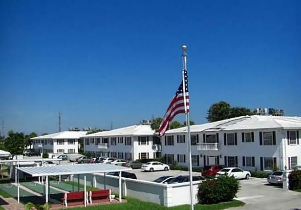 a room with pool table and windows