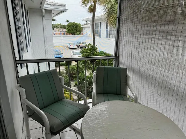 a view of balcony with furniture