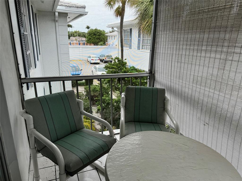 2171 Northeast 66th Street, Unit 830 Fort Lauderdale, FL 33308 - Photo 2 of 24 a view of balcony with furniture