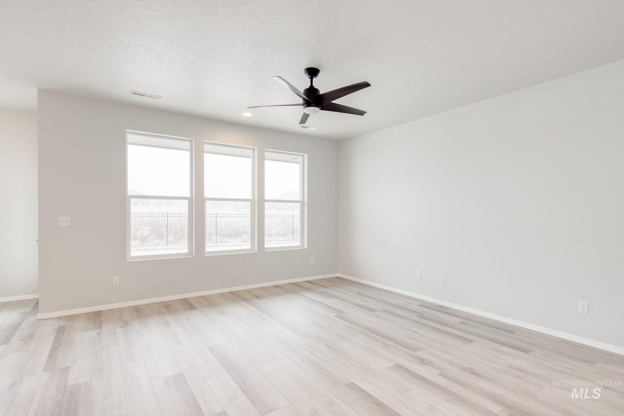 1672 Dyer Street Middleton, ID 83644 - Photo 10 of 24 Spare room with light wood-style flooring, ceiling fan, and recessed lighting