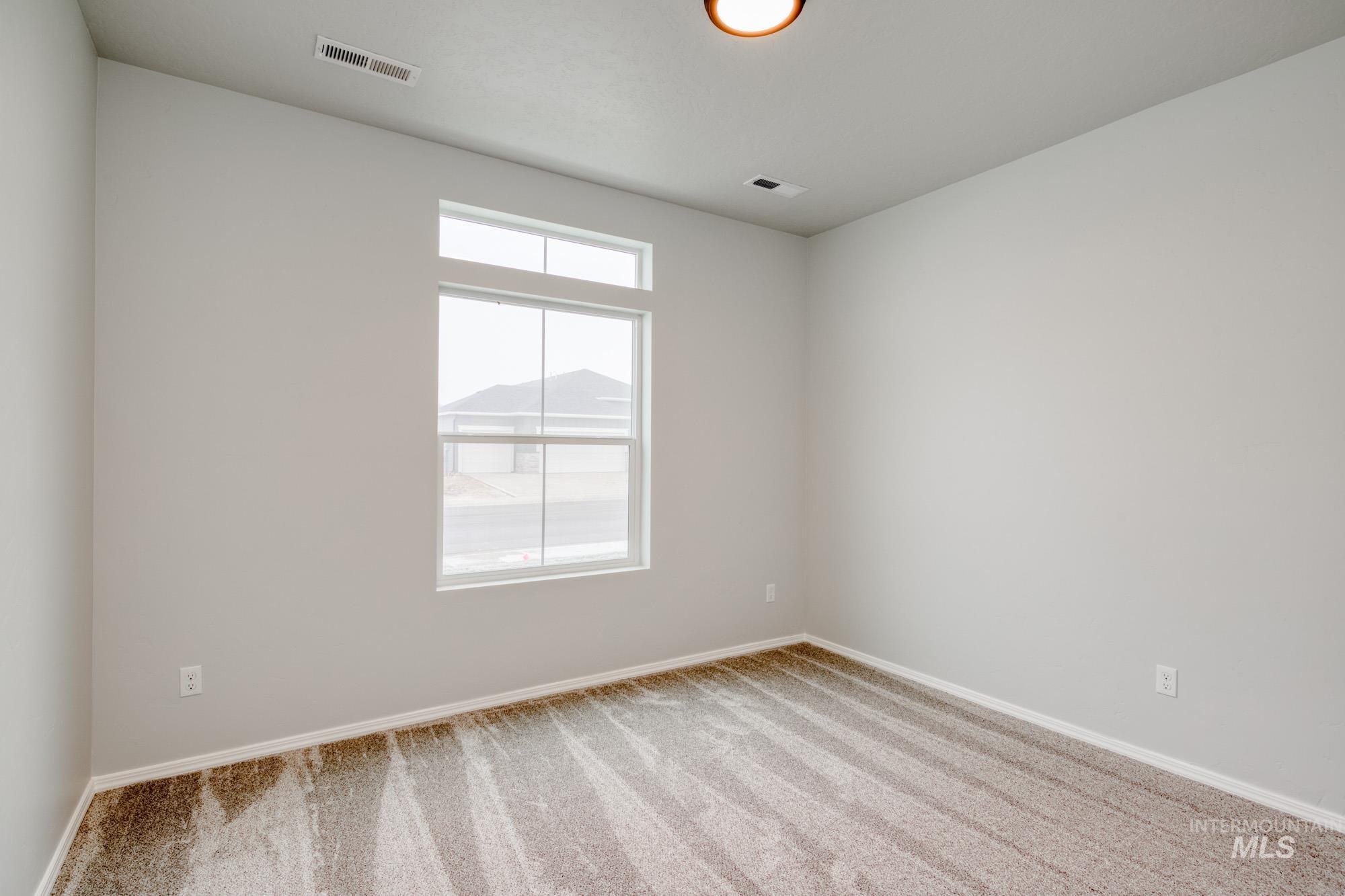 1672 Dyer Street Middleton, ID 83644 - Photo 12 of 24 Carpeted empty room with baseboards