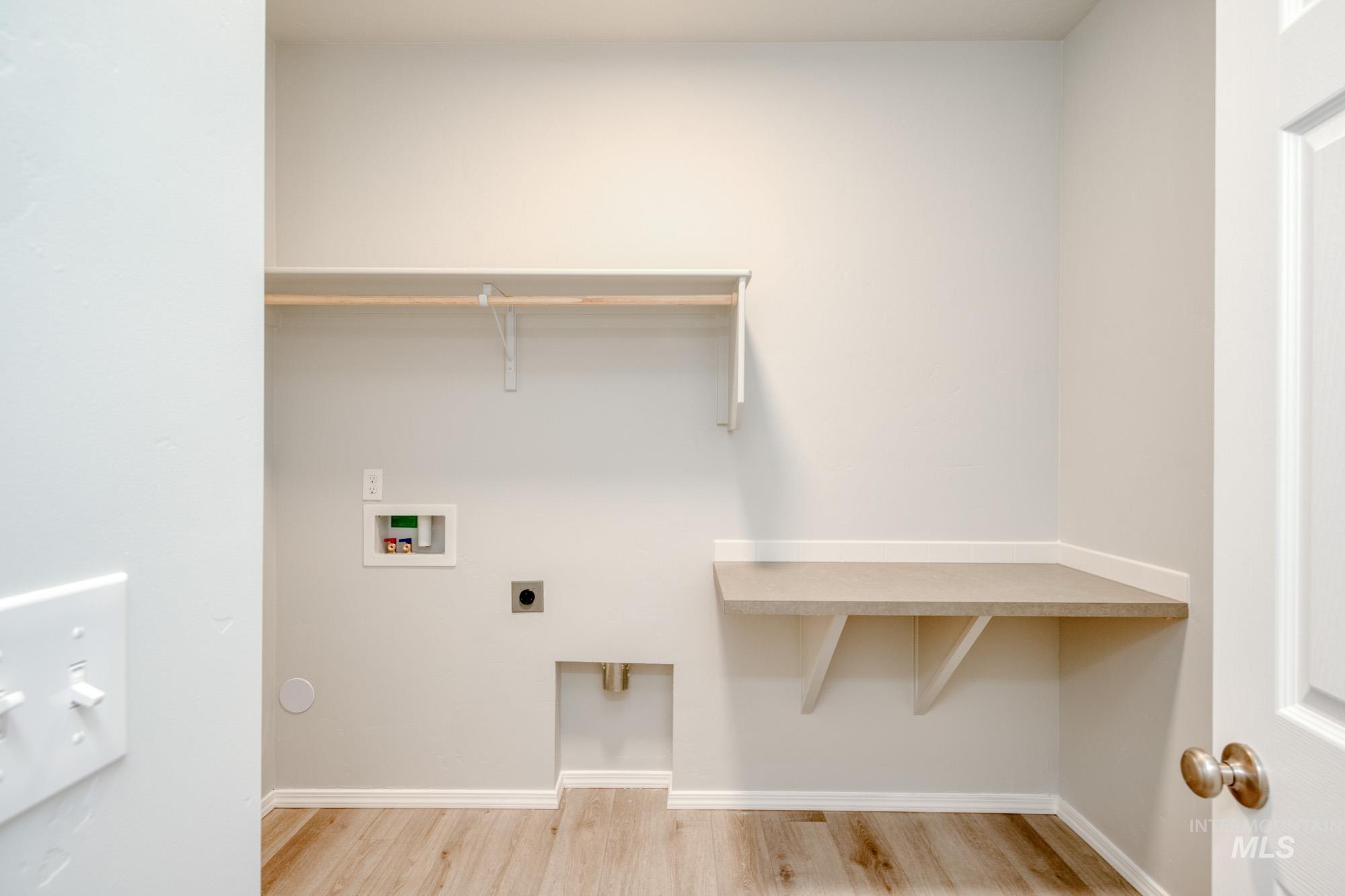 1672 Dyer Street Middleton, ID 83644 - Photo 15 of 24 Laundry area with light wood-style floors, hookup for an electric dryer, and washer hookup
