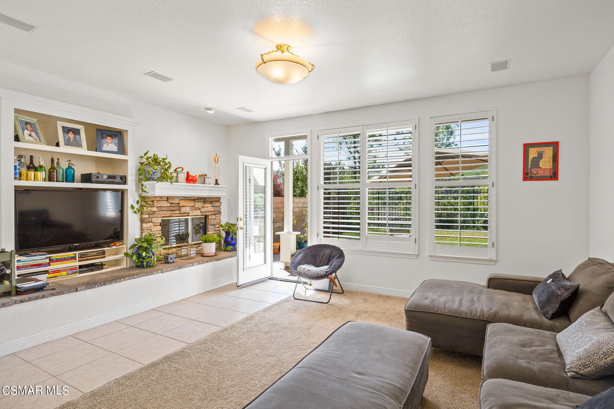 388 Woodland Road Simi Valley, CA 93065 - Photo 14 of 62 a living room with furniture and a flat screen tv