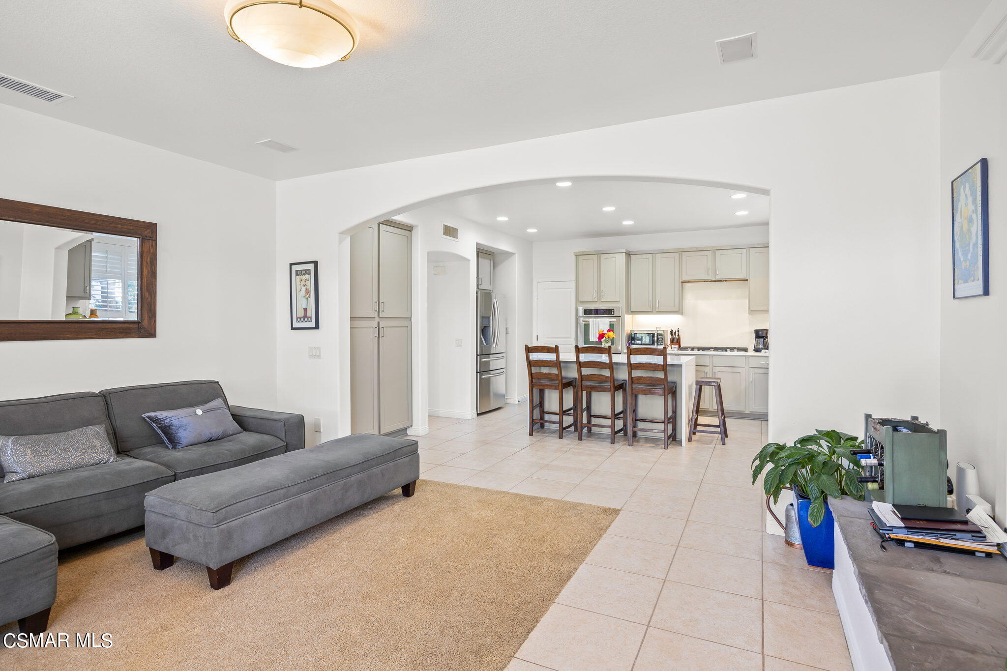 388 Woodland Road Simi Valley, CA 93065 - Photo 15 of 62 a living room with furniture and a dining table with wooden floor
