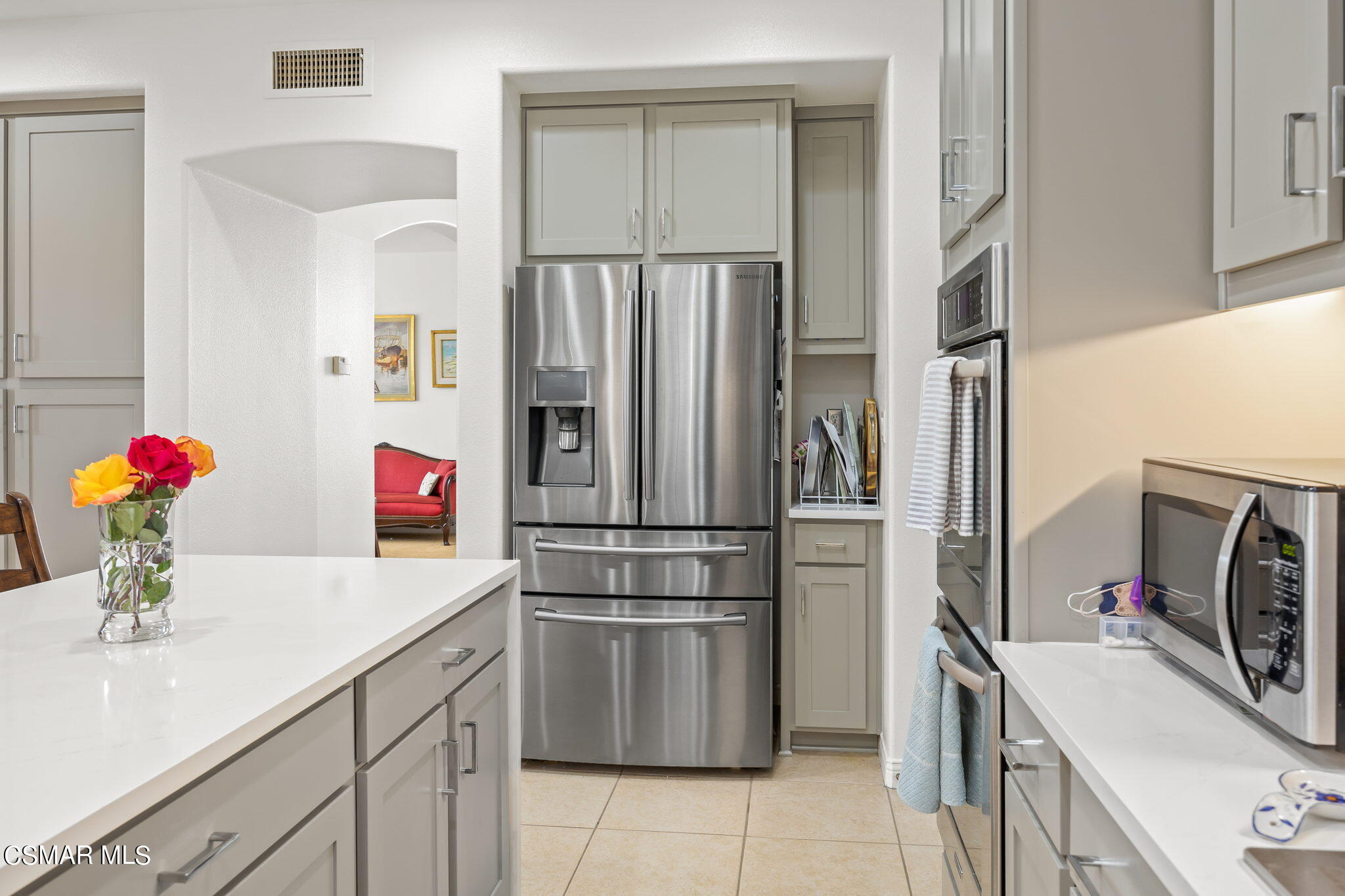 388 Woodland Road Simi Valley, CA 93065 - Photo 23 of 62 a kitchen with a sink stainless steel appliances and cabinets