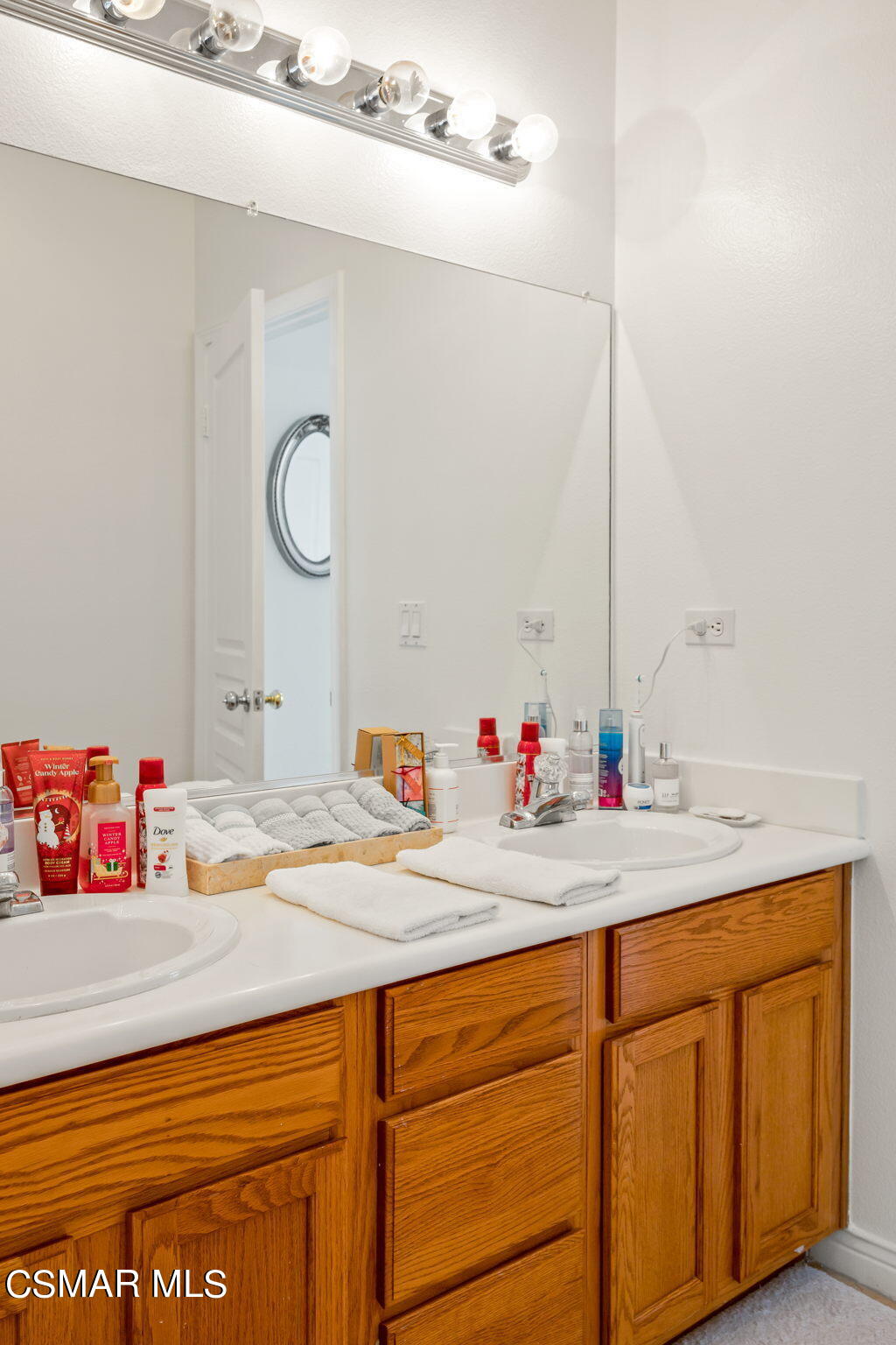 388 Woodland Road Simi Valley, CA 93065 - Photo 36 of 62 a bathroom with a sink and a mirror