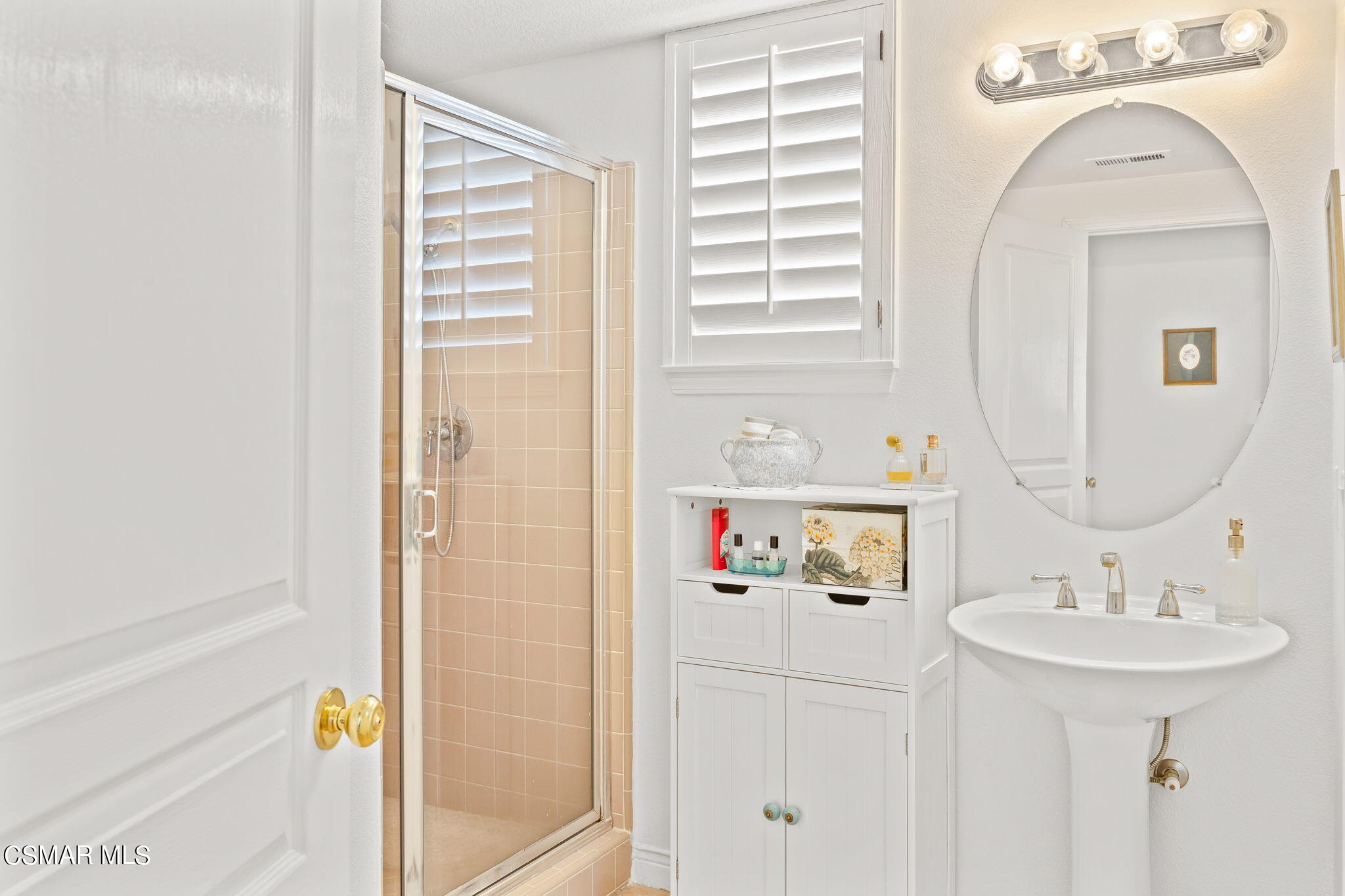 388 Woodland Road Simi Valley, CA 93065 - Photo 41 of 62 a bathroom with a sink and a mirror