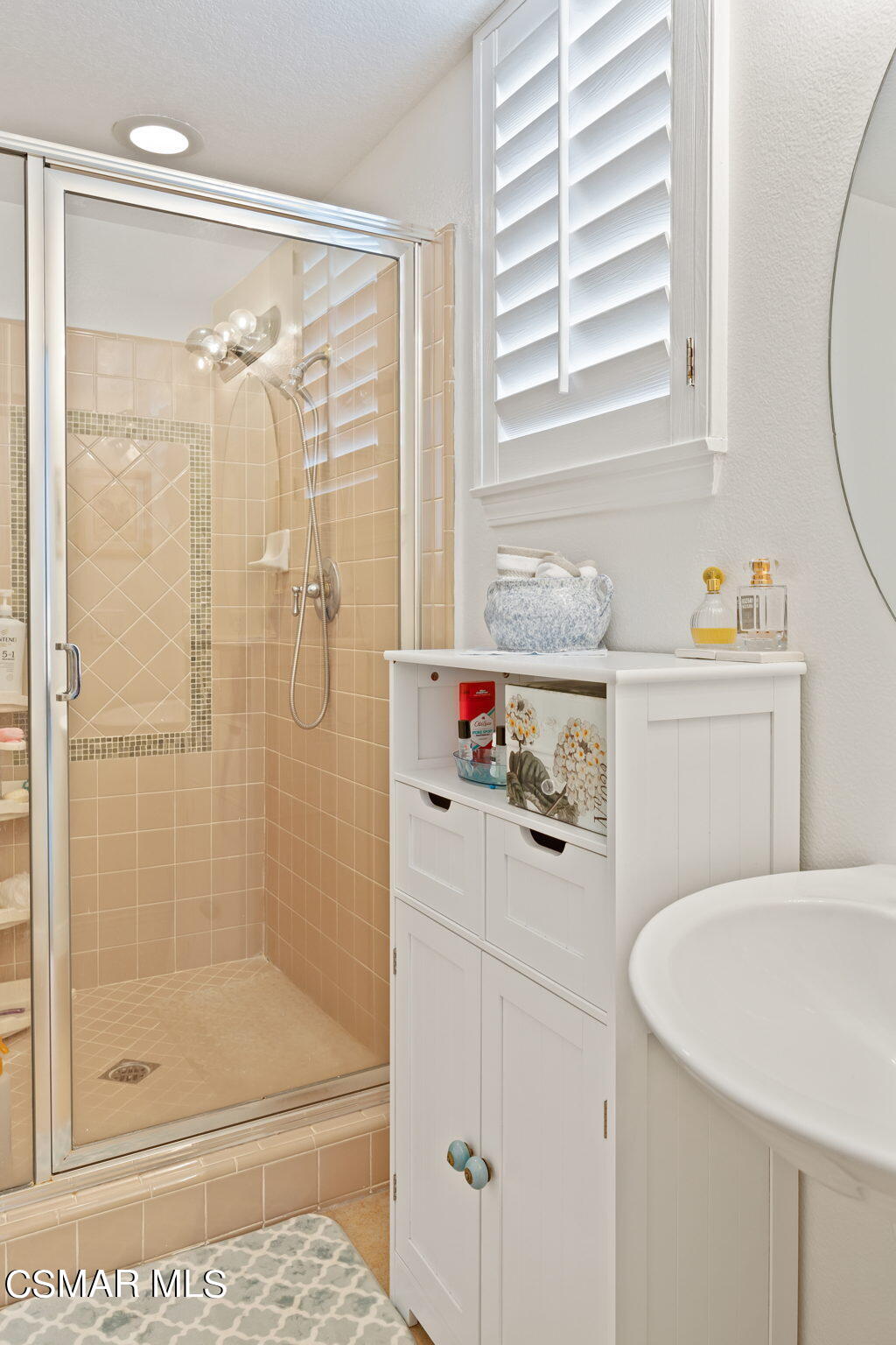 388 Woodland Road Simi Valley, CA 93065 - Photo 42 of 62 a bathroom with a shower sink and mirror