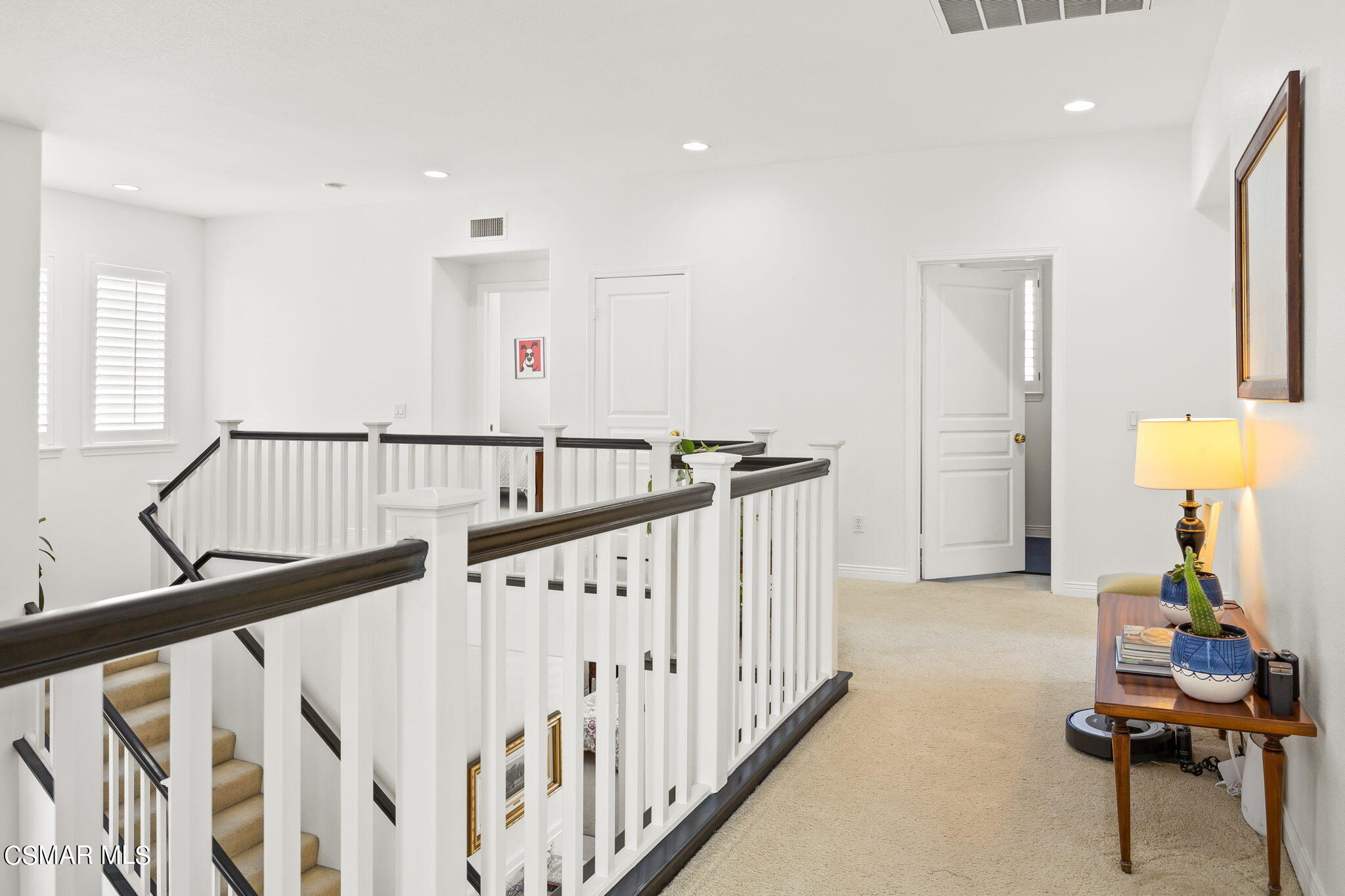 388 Woodland Road Simi Valley, CA 93065 - Photo 48 of 62 a view of a hallway with dining room and wooden floor