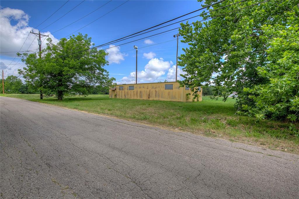 414 North Neal Street Commerce, TX 75428 - Photo 11 of 13 a view of a yard with an tree
