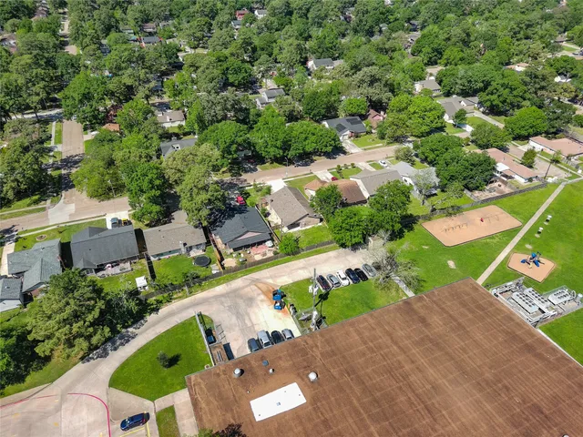 an aerial view of a house with a garden and plants
