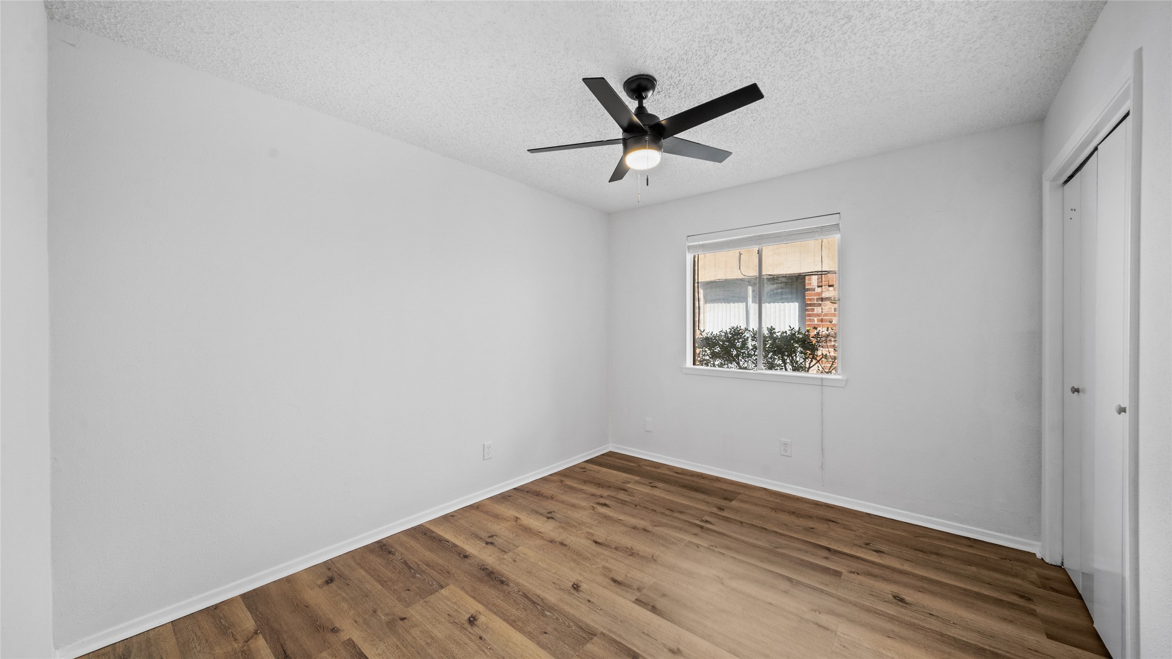 23414 Canyon Lake Drive Spring, TX 77373 - Photo 5 of 21 a view of empty room with wooden floor and fan