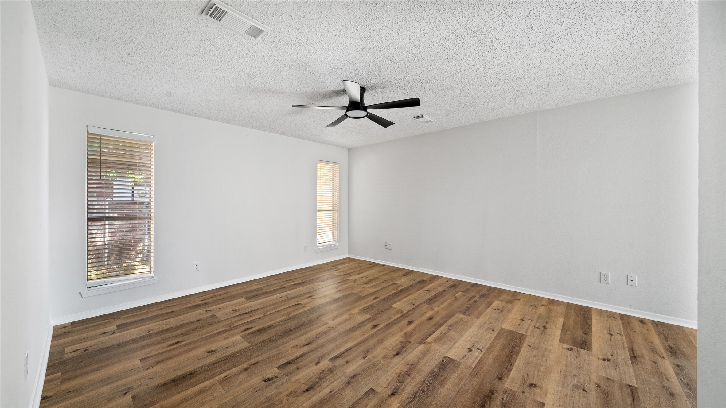 23414 Canyon Lake Drive Spring, TX 77373 - Photo 8 of 21 wooden floor in an empty room with a window